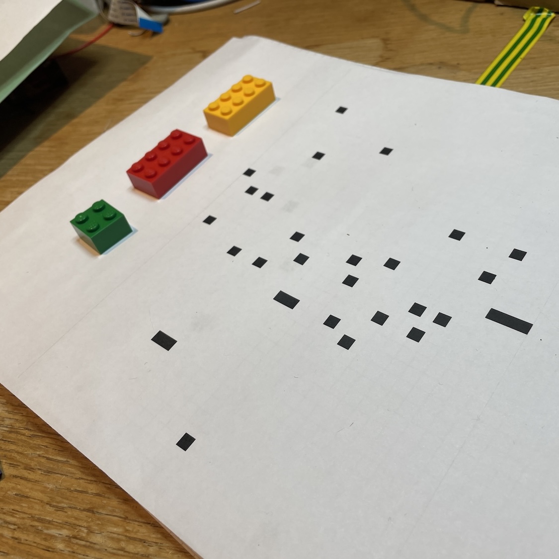 Some tiny printed squares and some lego pieces